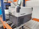 a cooler that is sitting on a shelf in a warehouse