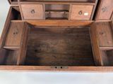 a wooden box with drawers and drawers inside of it