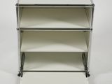 a white three tiered display case on wheels with a white background