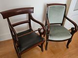 two chairs sitting next to each other on a hard wood floor