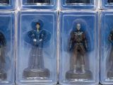 six action figures of a man in a suit in a box