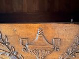 a close up of a wooden shelf with a clock on it