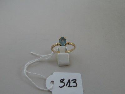 a ring with a blue stone on it and a price tag