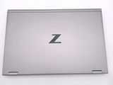 a silver laptop with a z logo on the screen