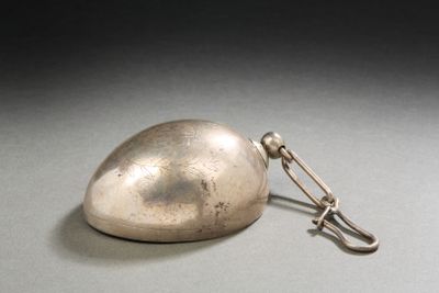 a small silver object with a metal hook on it
