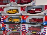 many different types of toy fire trucks in the box
