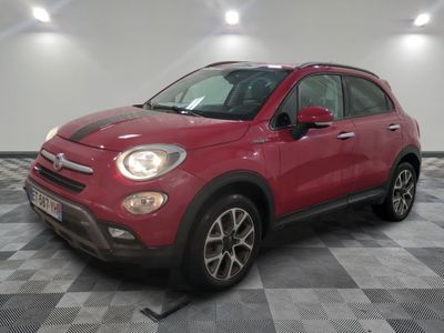 the red fiat suv is parked in a room with a checkered floor