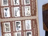 a lot of old photos on a book on a table