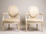 pair of louis xvi style armchairs with striped upholstered seats