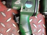 two air tools that are sitting on the floor