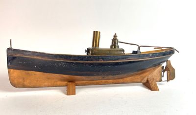 a small model of a boat on a wooden stand