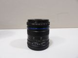 a black camera lens on a white table