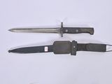 two knives that are laying next to each other on a table