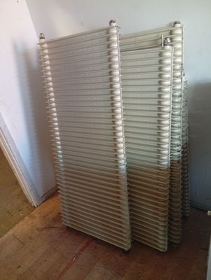 a radiator in the corner of a room next to a wall