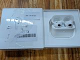 a box with an apple airpods in it on a table