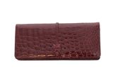 an image of a women ' s wallet with a red alligator skin pattern
