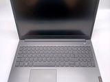 an open laptop computer sitting on top of a white table