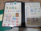 a book with stamps on it sitting on a table