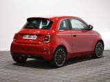 the rear end of a red smart car on a checkered floor