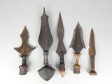 four different types of weapons are displayed on a white surface