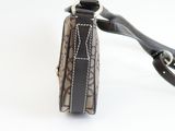 a small purse with a strap on it on a white surface