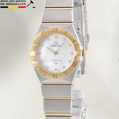 an image of a close up of a wrist watch with roman numerals