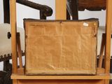 an old suitcase sitting on a wooden table
