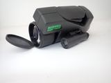 a black camera that is sitting on a white surface