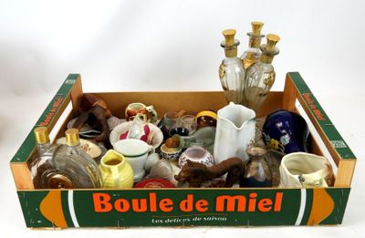 a box with a lot of bottles and vases in it