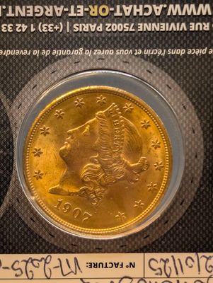 a picture of a gold coin with a picture of a woman on it
