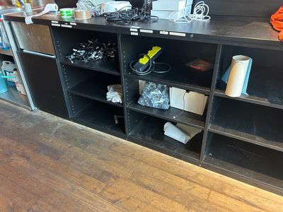 a shelf with many different items on it in a room