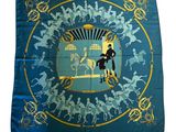blue silk scarf with a picture of a man riding a horse and a woman riding a horse