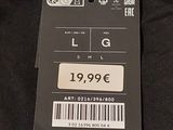a tag on the back of a black shirt
