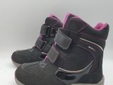 the children ' s boots are lined up and ready to go on the snow