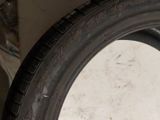 a tire that is sitting on the floor next to a wall