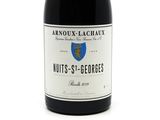 a bottle of wine that is sitting on a table
