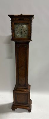 a grandfather clock that is standing on the floor