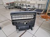 a black machine sitting on the floor in a room