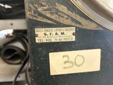 a close up of a scale with a clock on it