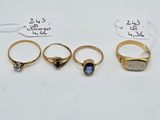 a group of five rings and a ring with a stone