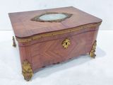 an image of a wooden box with a mirror on top of it