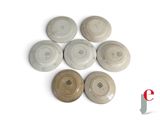 several plates are arranged in a circle on a white surface