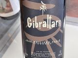 a bottle of wine that is sitting on a table