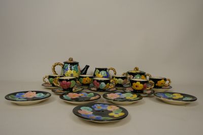 a lot of plates and cups that are on the table