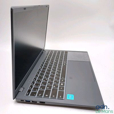 a laptop that is sitting on a white surface