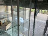a glass display case in the middle of a room
