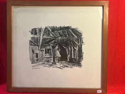 une image représentant un dessin d'un bâtiment, encadré et posé sur un tissu rouge