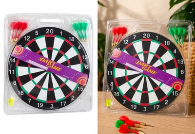 a close up of a dart board and darts in a package
