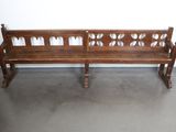 a wooden bench that is sitting in a room