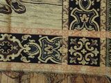 a close up of a rug with a picture of a cat on it